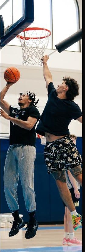 Jeff Dowtin Jr. finishing at the rim during a training session